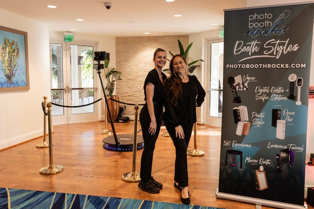 photo attendants with the 360 photo booth with velvet ropes and stanchions