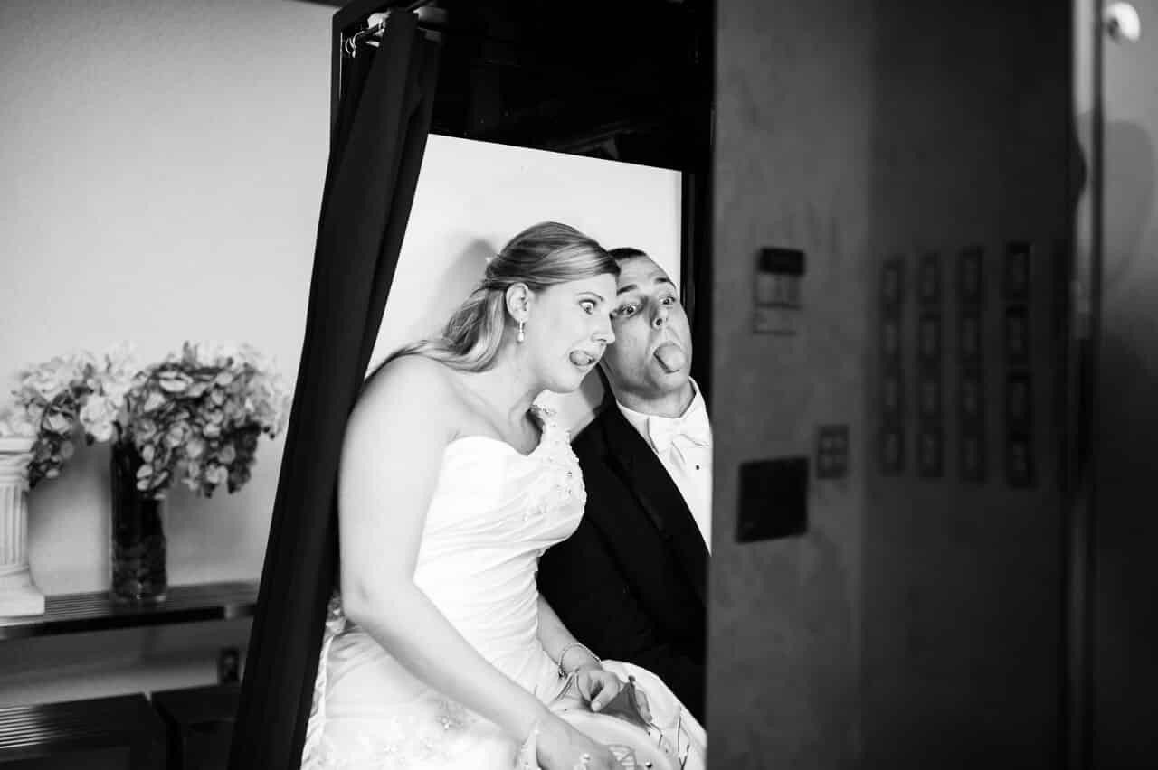 classic black photo booth at timacuan country club wedding with bride and groom