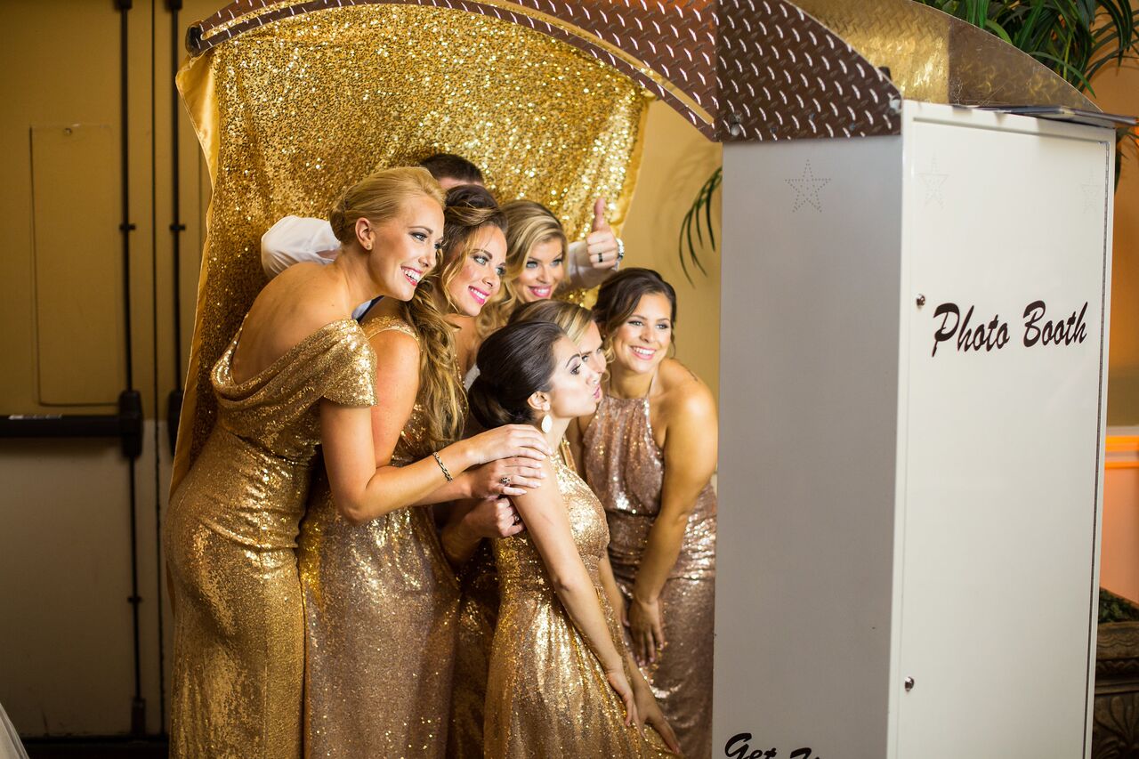 white printz photo booth with gold backrop at Holy Trinity Reception Center wedding