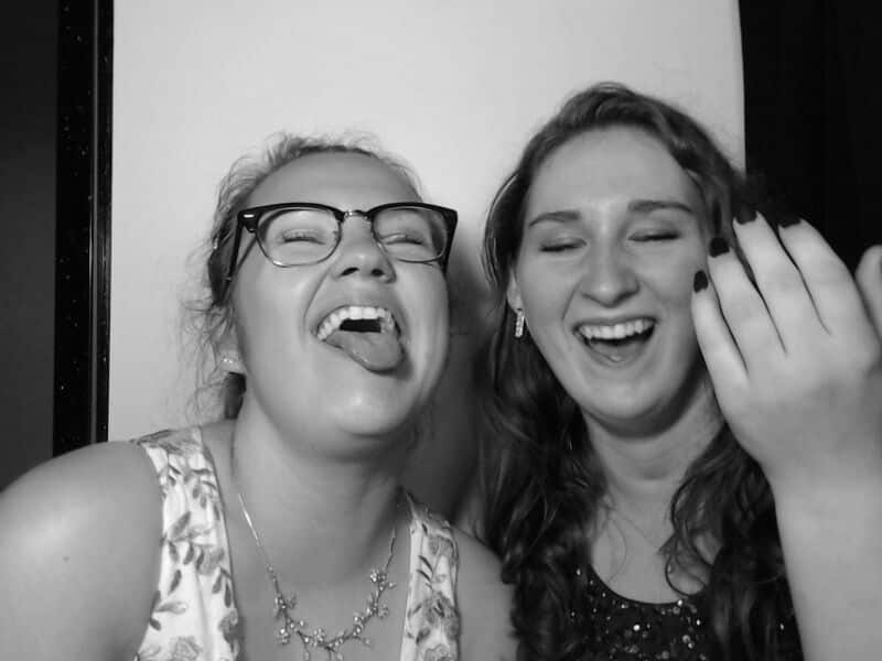 teens laughing in photo booth