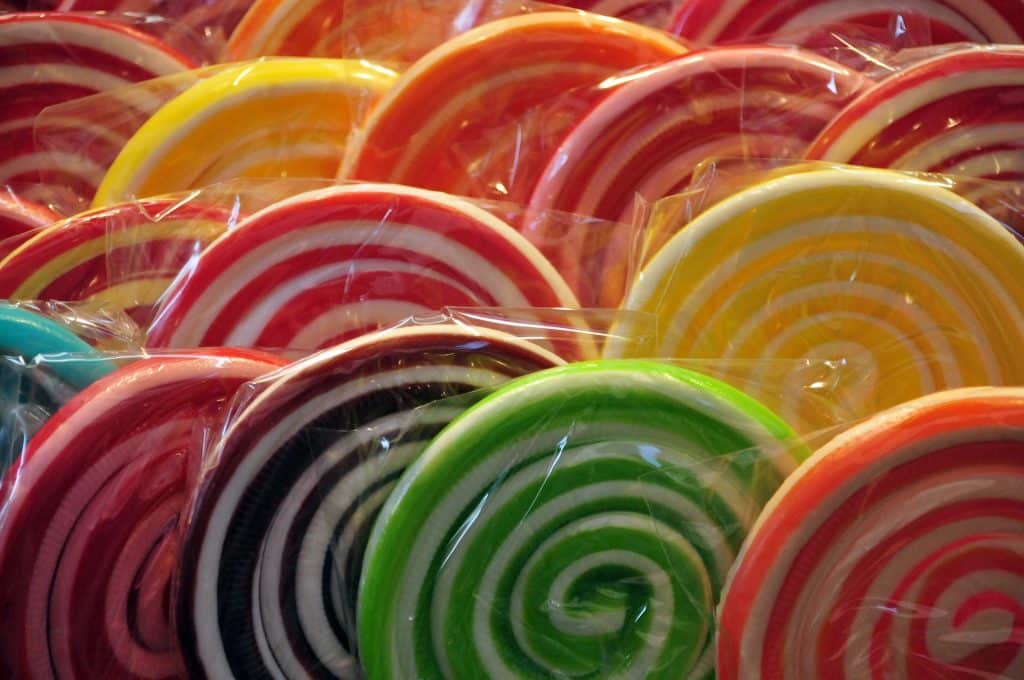 closeup of rows of large, colorful lollipops