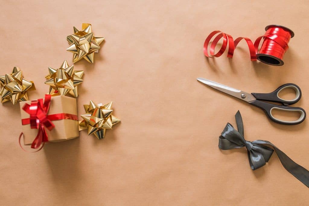 flatlay of scissors, ribbon, and bows