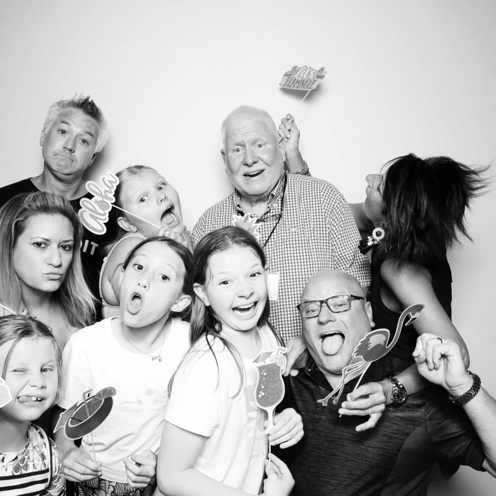 black and white photo of multigenerational family in video photo booth