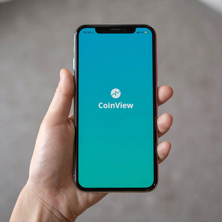 Cellphone open to the CoinView app.