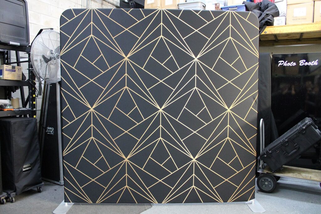 Black and gold geometric photo booth backdrop