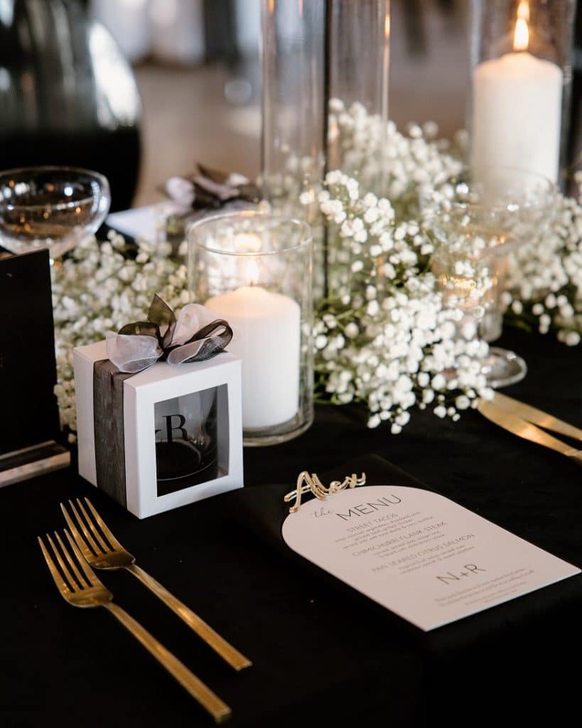 Black and white place setting at Nick and Rebecca's wedding