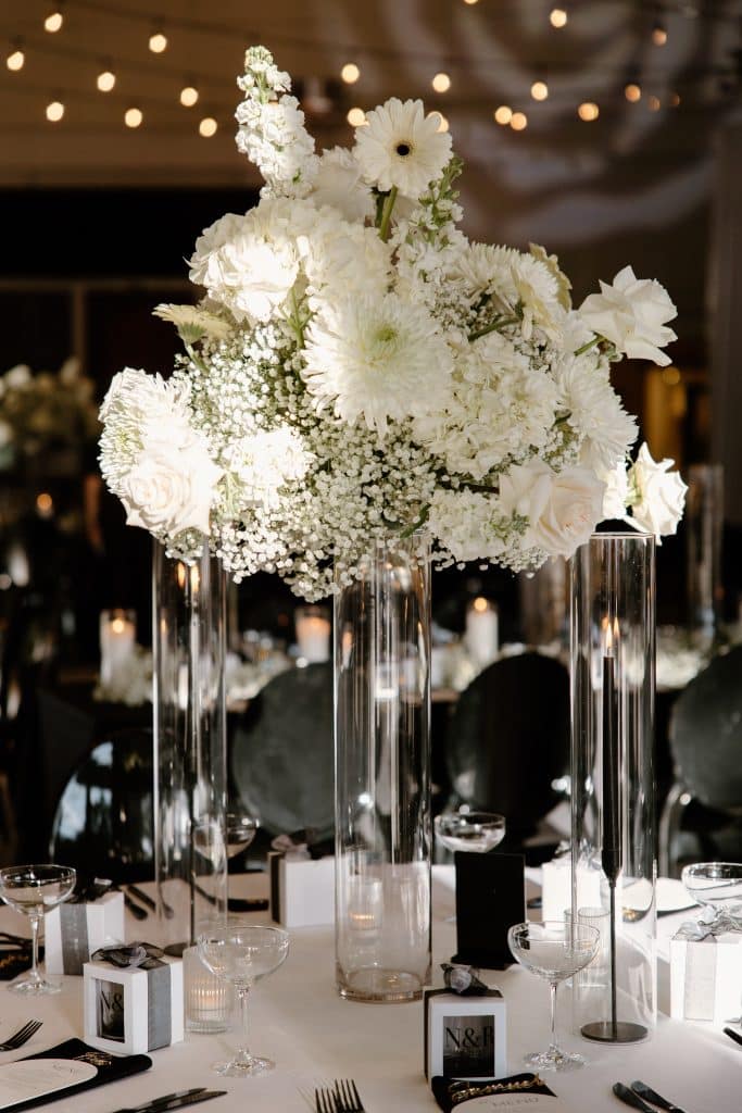 White floral centerpieces at Nick and Rebecca's wedding