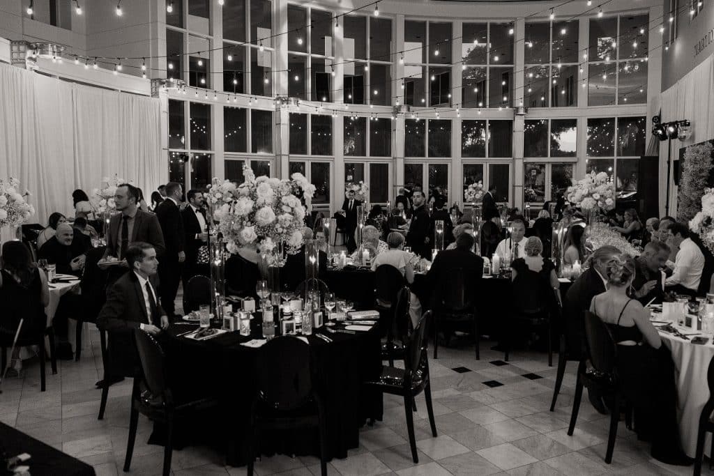 Black and white photo of the tables at Nick and Rebecca's wedding at the Orlando Museum of Art