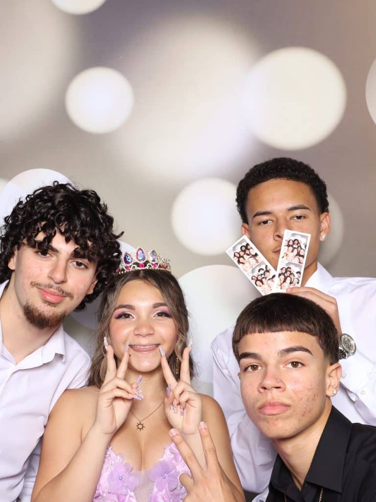 young people having fun in a photo booth