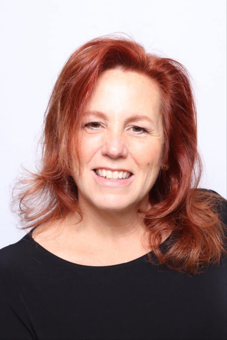 Corporate headshot taken at a photo booth in Orlando, professional in black on a white backdrop
