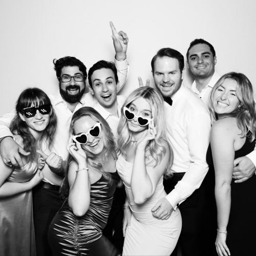 bride, groom and friends in the Glam Photo Booth